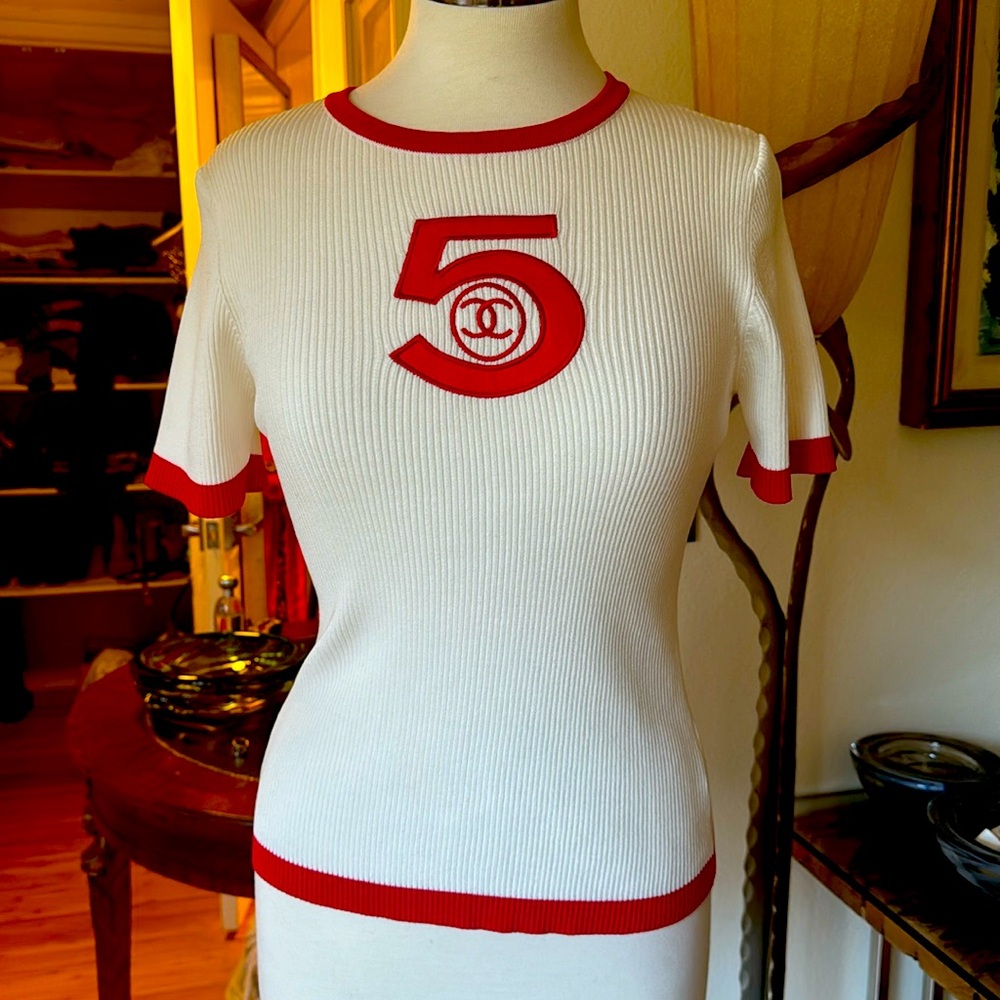Chanel white knitted top. Pre-own in excellent condition.